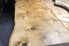 Oak-dining-table-with-green-resin-and-bow-ties-scaled